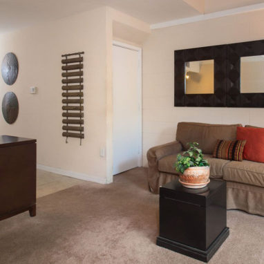 View of a love seat with a coffee table.